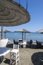 Beach unbrellas and chairs on sunny sandy beach Lady`s mile in Akritori, Cyprus