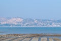 The beach under the blue sky, the laver and oyster farms are on the beach