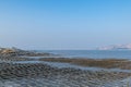 The beach under the blue sky, the laver and oyster farms are on the beach