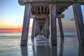 On the beach under the Naples Pier at sunset Royalty Free Stock Photo