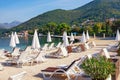 Beach vacation.  Beautiful Mediterranean landscape with beach umbrellas on sunny autumn day. Montenegro Royalty Free Stock Photo