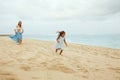 Beach Vacation. Family Walking Along Ocean Coast. Kids And Young Woman In Maxi Skirt Enjoying Summer Weekend At Resort. Royalty Free Stock Photo