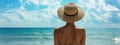 Beach vacation. Hot beautiful woman in sunhat and bikini standing enjoying looking view of beach ocean on hot summer day Royalty Free Stock Photo