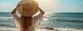 Beach vacation. Hot beautiful woman in sunhat standing enjoying looking view of beach ocean on hot summer day Royalty Free Stock Photo