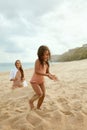 Beach Vacation. Mother And Daughter Enjoying Summertime At Tropical Resort. Little Tanned Girl Covered With Sand. Royalty Free Stock Photo