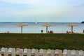 Beach vacation. Straw umbrellas on the coast.