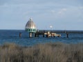 Beach vegegetation and the diving gondola or diving bell at the pier in Zingst on DarÃ Royalty Free Stock Photo