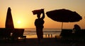 Beach vendor sunset Bali beach Royalty Free Stock Photo