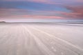 Beach view on lone ship on North sea