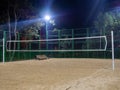 Beach volleyball court in the evening. Available infrastructure. Empty sports ground. Volleyball game concept. Sports mesh.