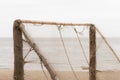 Beach volleyball net on desolate sea background