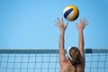 Beach volleyball player jumps on the net Royalty Free Stock Photo