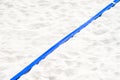 Beach volleyball, soccer, handball court up close and in detail with blue plastic line marker . Royalty Free Stock Photo