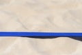 Beach volleyball, soccer, handball court up close and in detail with blue plastic line marker Royalty Free Stock Photo