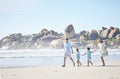 Beach, walking and family holding hands while on a vacation, holiday or adventure. Freedom, love and children with their Royalty Free Stock Photo