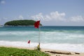 Beach warning red flags at Nai Harn beaches of Phuket Royalty Free Stock Photo