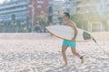 Beach water sports surfing man with body surfboard running