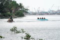 Beach water sports tubing with tourist being pulled by jetski in a beach in batam indonesia, Indonesia, May 4, 2019 Royalty Free Stock Photo