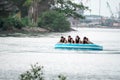 Beach water sports tubing with tourist being pulled by jetski in a beach in batam indonesia, Indonesia, May 4, 2019 Royalty Free Stock Photo