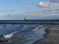 Beach, waves and the diving gondola or diving bell at the pier in Zingst on DarÃ Royalty Free Stock Photo