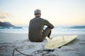 Beach, waves and surfer on surfing holiday in Hawaii to relax in peace on the sand by the ocean in nature. Back of man Royalty Free Stock Photo