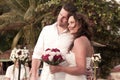 Beach wedding with bride, groom