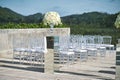 Beach wedding venue setup with roses and white flower on the mirror box vase decoration Royalty Free Stock Photo