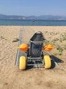 Beach wheel chair for disabled people in Nafplion, Greece Royalty Free Stock Photo