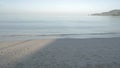 The beach with white sand and calm wave from peaceful sea