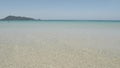 The beach with white sand and calm wave from peaceful sea