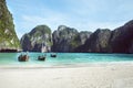 Beach with white sand landscape. Boat mooring in Asian style, canoe.