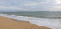 Beach with white sand ,sky is full of clouds ,sun is also blocked by clouds Royalty Free Stock Photo