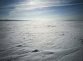 Beach in winter in Siberia. Snow and ice on the sea