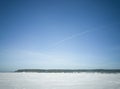 Beach in winter in Siberia. Snow and ice on the sea