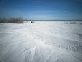 Beach in winter in Siberia. Snow and ice on the sea