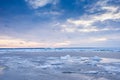 Beach in wintertime. Frozen sea, evening light and icy weather on shore like fairy tale country. Royalty Free Stock Photo