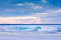 Beach in wintertime. Frozen sea, evening light and icy weather on shore like fairy tale country. Royalty Free Stock Photo