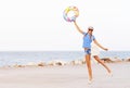 Beach woman happy and colorful wearing sunglasses and beach hat having summer fun during travel holidays