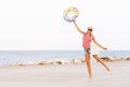 Beach woman happy and colorful wearing sunglasses and beach hat having summer fun during travel holidays vacation Royalty Free Stock Photo