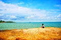 Beach with women and rocks of Samet Island Koh Samet, Rayong, Thailand.