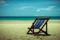 Beach wooden bed on white sand with beautiful blue sea Royalty Free Stock Photo