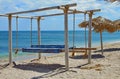 Seascape on Black Sea. Beach wooden canopy and thatched umbrella Royalty Free Stock Photo