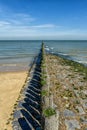 Beach with wooden weave breakers Royalty Free Stock Photo