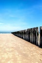 Beach with wooden weave breakers Royalty Free Stock Photo