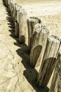 Beach with wooden weave breakers Royalty Free Stock Photo