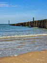 Beach with wooden weave breakers Royalty Free Stock Photo