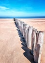 Beach with wooden weave breakers Royalty Free Stock Photo