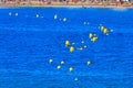 Beach with yellow buoys at sea Royalty Free Stock Photo