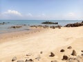 Beach With Yellow Sand And Beautiful Rocks In Tanjung Kalian, Indonesia