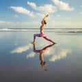 Beach yoga. Slim Caucasian woman practicing Virabhadrasana II, Warrior II Pose. Strong body. Healthy lifestyle. Water reflection. Royalty Free Stock Photo